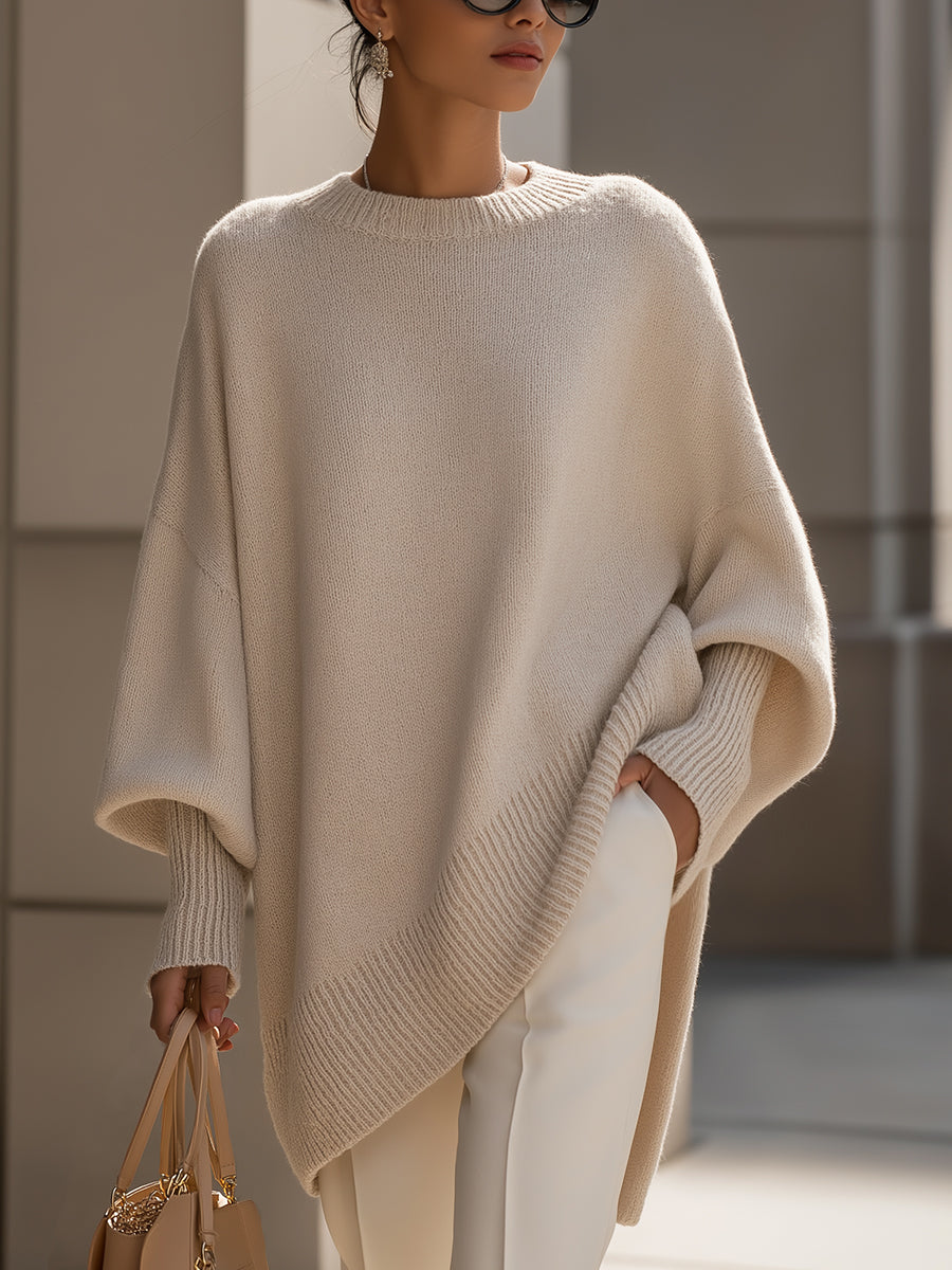 Suéter poncho oversize de punto Elena de Veyro Madrid, en color neutro, mostrando su diseño amplio y cómodo.