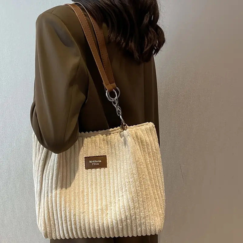 Bolso de pana Veyro Madrid con asas dobles, diseño elegante y detalles en tonos neutros, ideal para uso diario.
