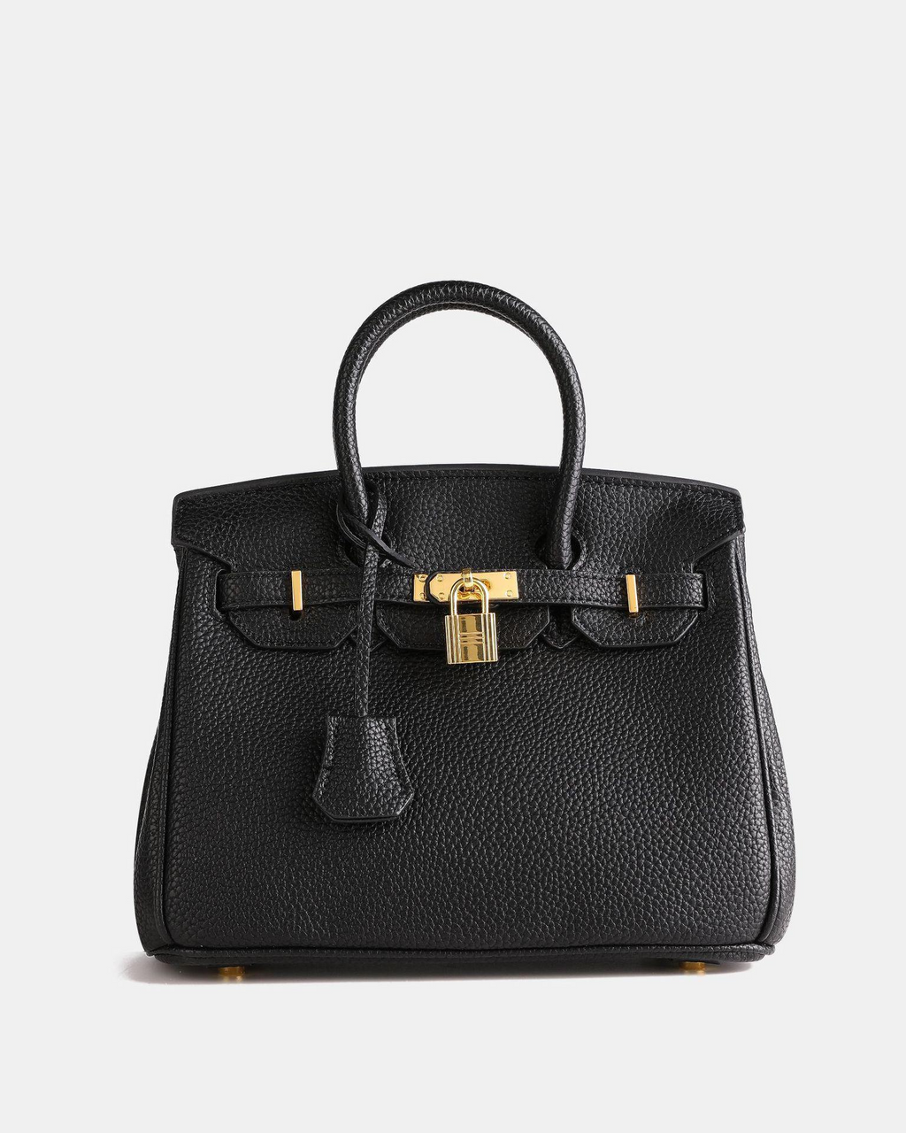 Bolso de cuero MILA de Veyro Madrid con asas cortas y acabado en cuero liso sobre fondo neutro.
