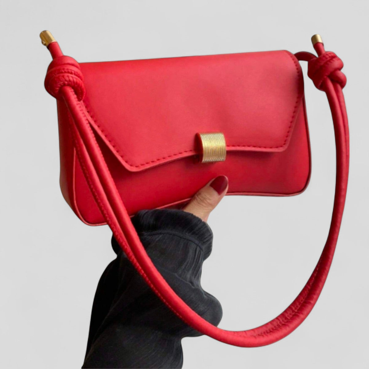 Bolso de mano Veyro Madrid Etelvina en piel, con diseño elegante y detalles de alta calidad, ideal para ocasiones formales.