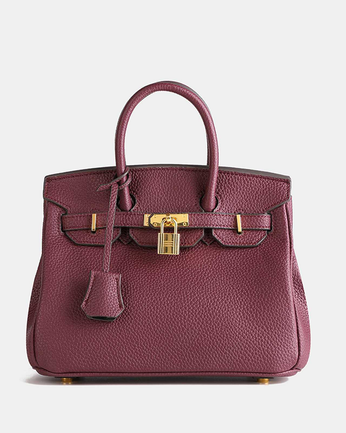 Bolso de cuero MILA de Veyro Madrid, elegante y compacto, con asas cortas y acabado en cuero natural, ideal para ocasiones elegantes.