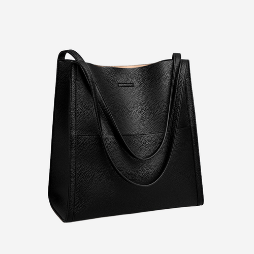 Bolso de piel Avalyn de Veyro Madrid con estructura y correa, bolso de hombro elegante sobre fondo neutro.