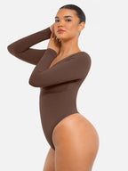 Body suit moldeador de manga larga Veyro Madrid, ajustado y sin costuras, con control de abdomen y estilo tanga, en color negro.
