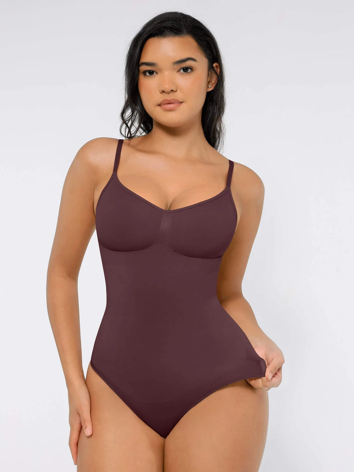 Body suit moldeador con espalda baja de Veyro Madrid, diseño sin costuras y control abdominal visible en la imagen.