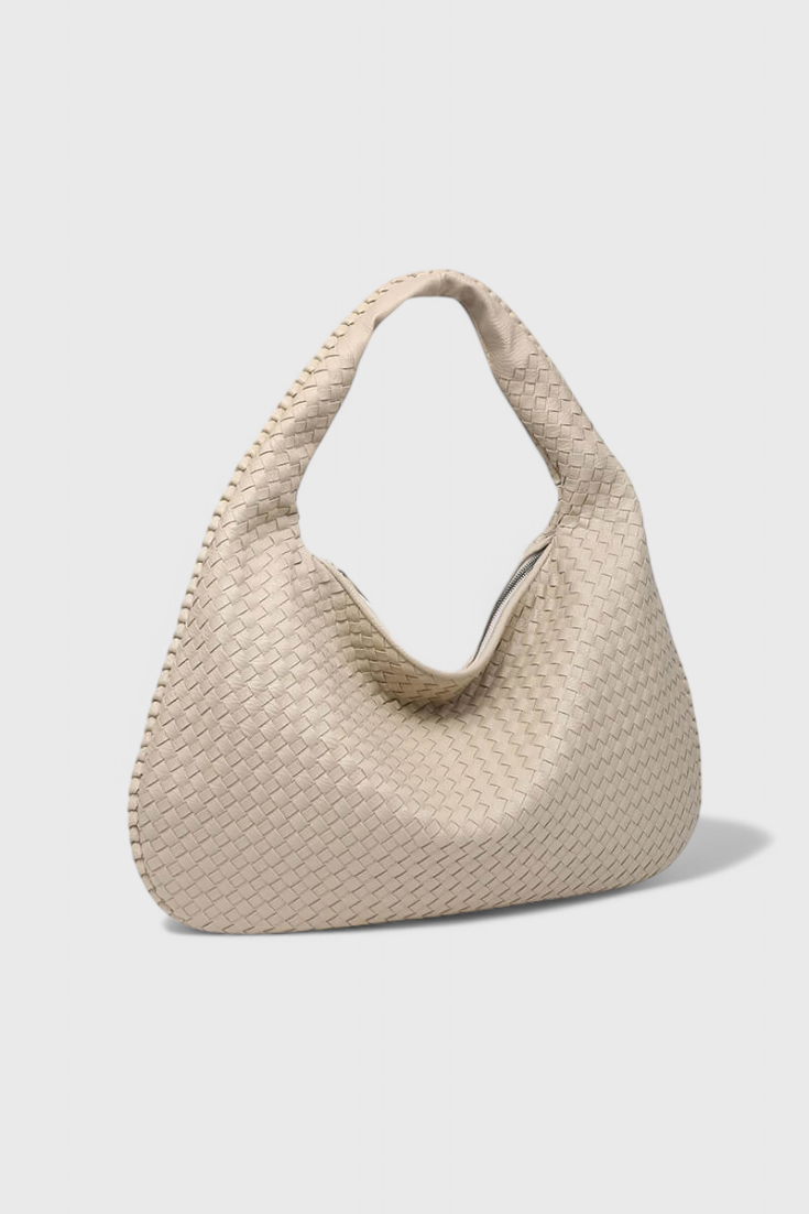Bolso de hombro tejido Tilly de Veyro Madrid, con diseño artesanal y asas en colores neutros, ideal para estilo casual.