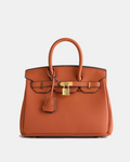 Bolso de cuero MILA de Veyro Madrid, con diseño elegante y asa de mano, en color marrón.