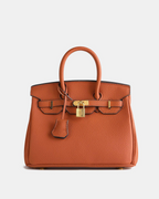Bolso de cuero MILA de Veyro Madrid, con diseño elegante y asa de mano, en color marrón.