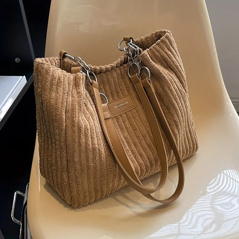 Bolso de pana Veyro Madrid con asas dobles, diseño elegante y práctico en tonos neutros.